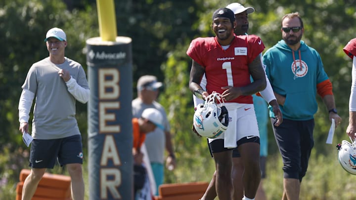 Miami Dolphins quarterback Tua Tagovailoa (1) walks on the field during joint training camp practice with the Chicago Bears ahead of Sunday's preseason opener.