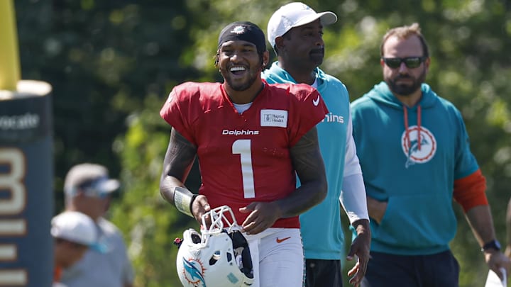 Miami Dolphins quarterback Tua Tagovailoa (1) walks on the field during joint training camp practice with the Chicago Bears ahead of Sunday's preseason opener. 