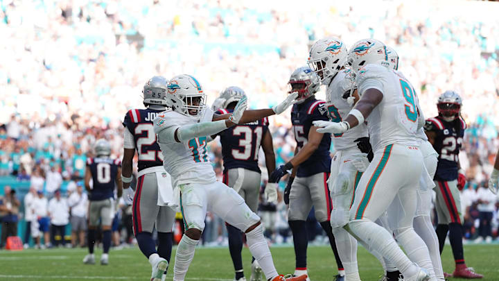 Miami Dolphins wide receiver Jaylen Waddle (17) celebrates his touchdown against the New England Patriots with teammates on the field during the second half at Hard Rock Stadium. Miami Dolphins wide receiver Jaylen Waddle (17) celebrates his touchdown against the New England Patriots with teammates on the field during the second half at Hard Rock Stadium.