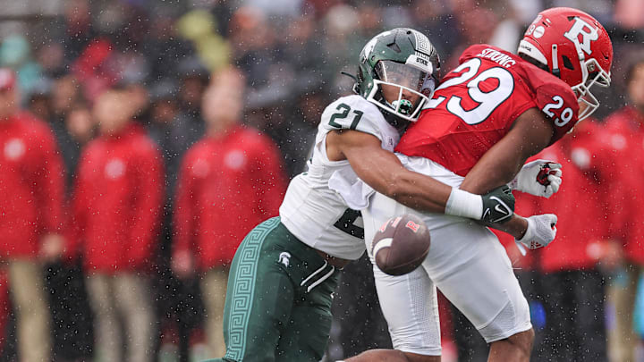 Oct 14, 2023; Piscataway, New Jersey, USA; Michigan State Spartans defensive back Dillon Tatum (21) breaks up a pass intended for Rutgers Scarlet Knights wide receiver Ian Strong (29) during the first half at SHI Stadium. Mandatory Credit: Vincent Carchietta-Imagn Images