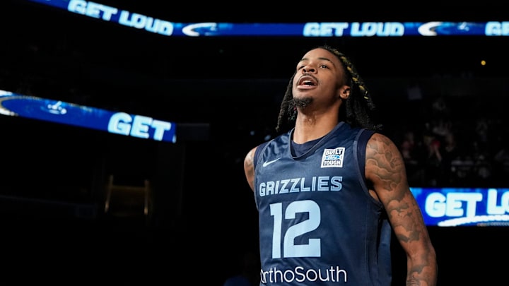 Memphis Grizzlies guard Ja Morant (12) runs on the court as he is introduced during open practice at FedExForum.
