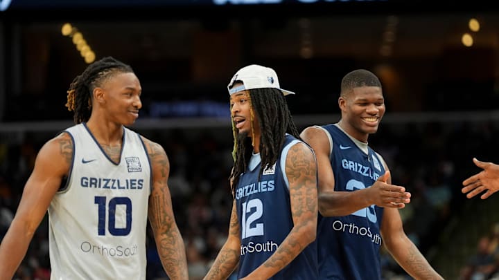 Grizzlies' Javon Small (10) and Ja Morant (12) talk as they and Cedric Coward (23) walk off the court during open practice at the FedExForum on October 4, 2025, in Memphis, Tenn. Grizzlies' Javon Small (10) and Ja Morant (12) talk as they and Cedric Coward (23) walk off the court during open practice at the FedExForum on October 4, 2025, in Memphis, Tenn.
