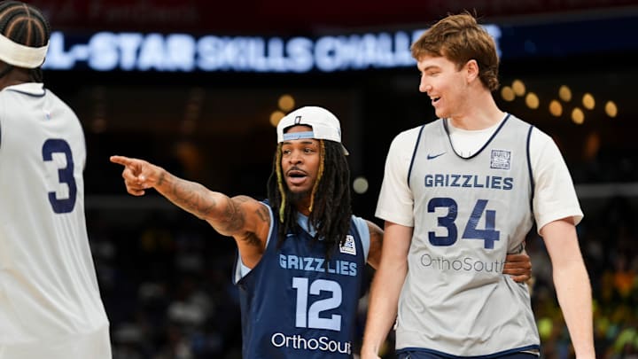 Grizzlies' Ja Morant (12) congratulates Lawson Lovering (34) after he took part in the skills challenge during open practice at the FedExForum on October 4, 2025, in Memphis, Tenn. Grizzlies' Ja Morant (12) congratulates Lawson Lovering (34) after he took part in the skills challenge during open practice at the FedExForum on October 4, 2025, in Memphis, Tenn.