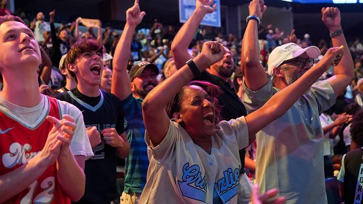 Grizzlies fans react to the Grizzlies drafting Cameron Boozer with the third pick in the 2026 NBA Draft as mascot Grizz shoots off a smoke gun during a draft watch party at FedExForum in Memphis, Tenn., on June 23, 2026. Grizzlies fans react to the Grizzlies drafting Cameron Boozer with the third pick in the 2026 NBA Draft as mascot Grizz shoots off a smoke gun during a draft watch party at FedExForum in Memphis, Tenn., on June 23, 2026.