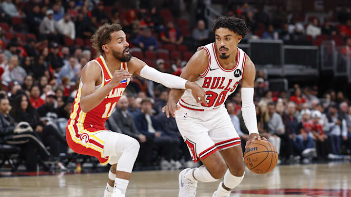 Oct 27, 2025; Chicago, Illinois, USA; Chicago Bulls guard Tre Jones (30) drives to the basket against Atlanta Hawks guard Trae Young (11) during the first half at United Center. Mandatory Credit: Kamil Krzaczynski-Imagn Images Oct 27, 2025; Chicago, Illinois, USA; Chicago Bulls guard Tre Jones (30) drives to the basket against Atlanta Hawks guard Trae Young (11) during the first half at United Center. Mandatory Credit: Kamil Krzaczynski-Imagn Images