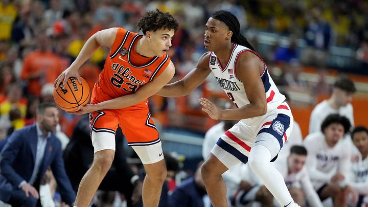 Illinois Fighting Illini guard Keaton Wagler (23) is guarded Saturday, April 4, 2026, by UConn Huskies guard Silas Demary Jr. (2) during a Final Four game at Lucas Oil Stadium in Indianapolis. Illinois Fighting Illini guard Keaton Wagler (23) is guarded Saturday, April 4, 2026, by UConn Huskies guard Silas Demary Jr. (2) during a Final Four game at Lucas Oil Stadium in Indianapolis.