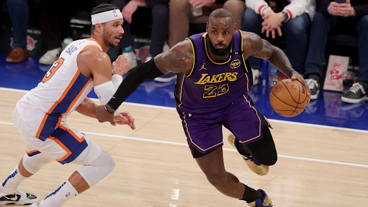 Feb 1, 2025; New York, New York, USA; Los Angeles Lakers forward LeBron James (23) drives to the basket against New York Knicks guard Josh Hart (3) during the fourth quarter at Madison Square Garden. Mandatory Credit: Brad Penner-Imagn Images