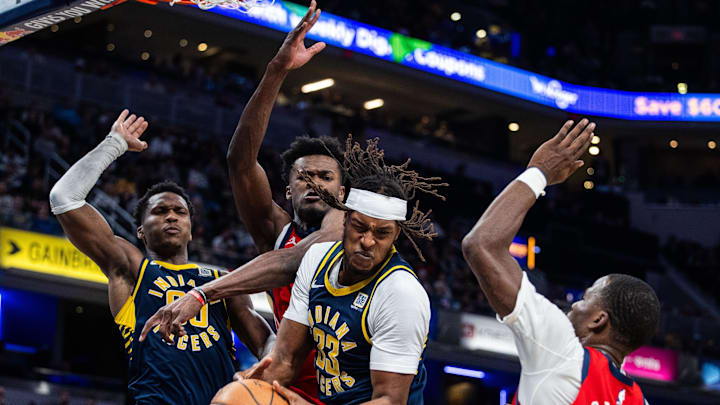 Nov 25, 2024; Indianapolis, Indiana, USA; Indiana Pacers center Myles Turner (33) rebounds the ball while New Orleans Pelicans center Yves Missi (21) defends in the second half at Gainbridge Fieldhouse. Mandatory Credit: Trevor Ruszkowski-Imagn Images Nov 25, 2024; Indianapolis, Indiana, USA; Indiana Pacers center Myles Turner (33) rebounds the ball while New Orleans Pelicans center Yves Missi (21) defends in the second half at Gainbridge Fieldhouse. Mandatory Credit: Trevor Ruszkowski-Imagn Images