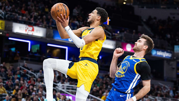 Jan 10, 2025; Indianapolis, Indiana, USA; Indiana Pacers guard Tyrese Haliburton (0) shoots the ball while Golden State Warriors guard Pat Spencer (61) defends in the second half at Gainbridge Fieldhouse. Mandatory Credit: Trevor Ruszkowski-Imagn Images Jan 10, 2025; Indianapolis, Indiana, USA; Indiana Pacers guard Tyrese Haliburton (0) shoots the ball while Golden State Warriors guard Pat Spencer (61) defends in the second half at Gainbridge Fieldhouse. Mandatory Credit: Trevor Ruszkowski-Imagn Images
