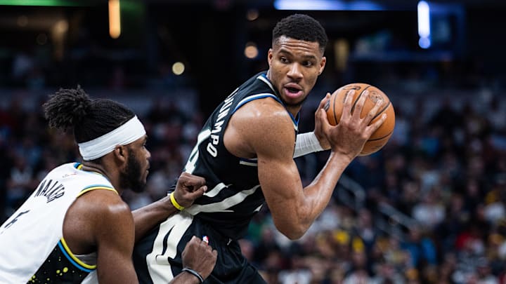 Dec 31, 2024; Indianapolis, Indiana, USA; Milwaukee Bucks forward Giannis Antetokounmpo (34) holds the ball while Indiana Pacers forward Jarace Walker (5) defends in the second half at Gainbridge Fieldhouse. Mandatory Credit: Trevor Ruszkowski-Imagn Images Dec 31, 2024; Indianapolis, Indiana, USA; Milwaukee Bucks forward Giannis Antetokounmpo (34) holds the ball while Indiana Pacers forward Jarace Walker (5) defends in the second half at Gainbridge Fieldhouse. Mandatory Credit: Trevor Ruszkowski-Imagn Images