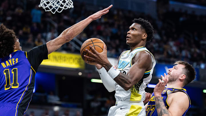 Mar 26, 2025; Indianapolis, Indiana, USA; Indiana Pacers guard Bennedict Mathurin (00) shoots the ball while Los Angeles Lakers center Jaxson Hayes (11) defends in the first half at Gainbridge Fieldhouse. Mandatory Credit: Trevor Ruszkowski-Imagn Images