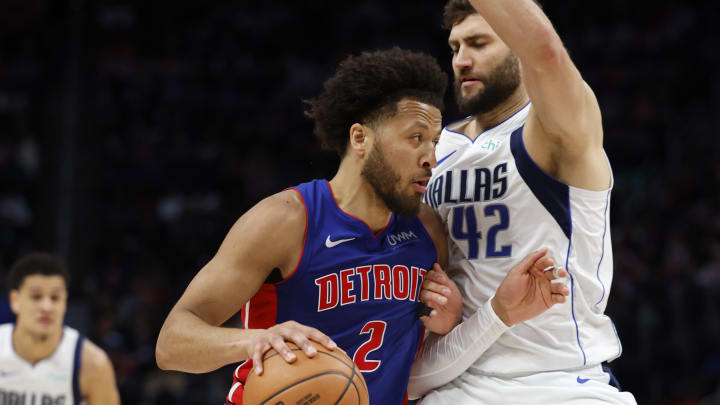 Mar 9, 2024; Detroit, Michigan, USA;  Detroit Pistons guard Cade Cunningham (2) dribbles defended by Dallas Mavericks forward Maxi Kleber (42) in the second half at Little Caesars Arena. Mandatory Credit: Rick Osentoski-USA TODAY Sports