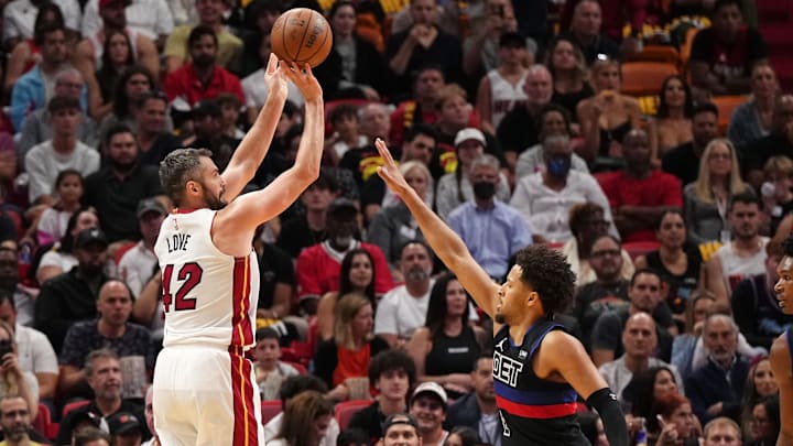 Oct 25, 2023; Miami, Florida, USA; Miami Heat forward Kevin Love (42) shoots the ball over Detroit Pistons guard Cade Cunningham (2) during the first half at Kaseya Center. Mandatory Credit: Jasen Vinlove-Imagn Images