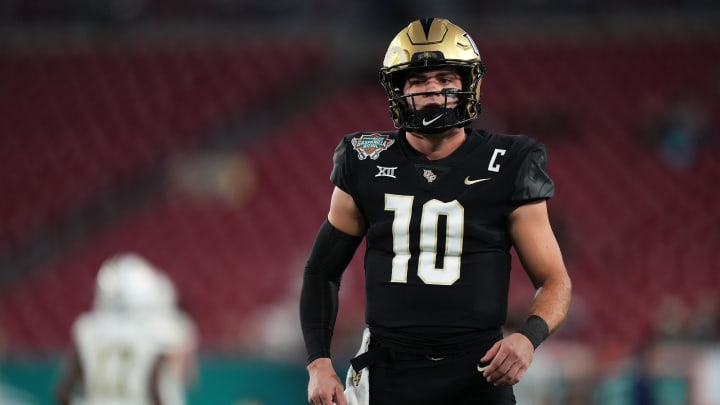 Dec 22, 2023; Tampa, FL, USA; UCF Knights quarterback John Rhys Plumlee (10) warms up prior to the Gasparilla Bowl against the Georgia Tech Yellow Jackets at Raymond James Stadium. Mandatory Credit: Jasen Vinlove-USA TODAY Sports