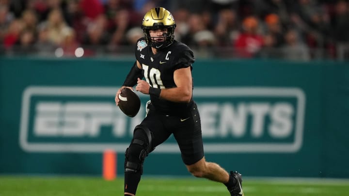 Dec 22, 2023; Tampa, FL, USA; UCF Knights quarterback John Rhys Plumlee (10) scrambles with the ball during the first half of the Gasparilla Bowl against the Georgia Tech Yellow Jackets at Raymond James Stadium. Mandatory Credit: Jasen Vinlove-USA TODAY Sports