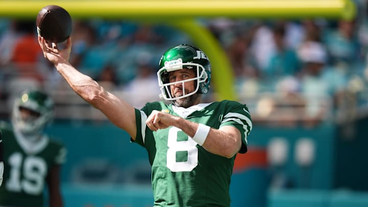 Dec 8, 2024; Miami Gardens, Florida, USA; New York Jets quarterback Aaron Rodgers (8) warms up prior to the game against the Miami Dolphins at Hard Rock Stadium. Mandatory Credit: Jasen Vinlove-Imagn Images