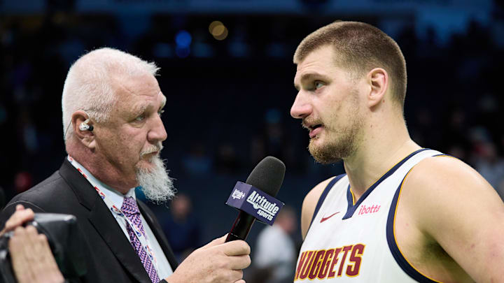 Feb 1, 2025; Charlotte, North Carolina, USA; Denver Nuggets center Nikola Jokic (15) is interviewed by Scott Hastings of Altitude Sports following the game against the Charlotte Hornets at Spectrum Center. Mandatory Credit: Brian Westerholt-Imagn Images