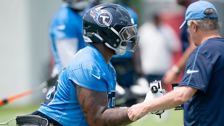 Tennessee Titans tackle JC Latham (55) goes through drills during mandatory Titans Minicamp at Ascension Saint Thomas Sports Park in Nashville, Tenn., Tuesday, June 10, 2025.