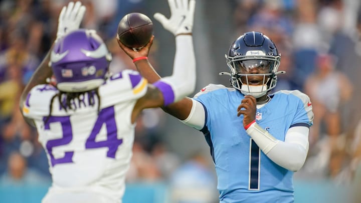 Tennessee Titans quarterback Cam Ward (1) throws the ball under pressure from Minnesota Vikings safety Jay Ward (24) during the first quarter of an NFL pre-season game at Nissan Stadium in Nashville, Tenn., Friday, Aug. 22, 2025.