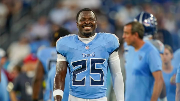 Tennessee Titans safety Xavier Woods (25) smiles from the sidelines during the first quarter of an NFL pre-season game against the Minnesota Vikings at Nissan Stadium in Nashville, Tenn., Friday, Aug. 22, 2025.