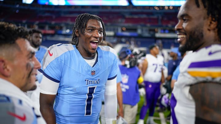 Tennessee Titans quarterback Cam Ward (1) talks with other players after an NFL pre-season game against the Minnesota Vikings at Nissan Stadium in Nashville, Tenn., Friday, Aug. 22, 2025.