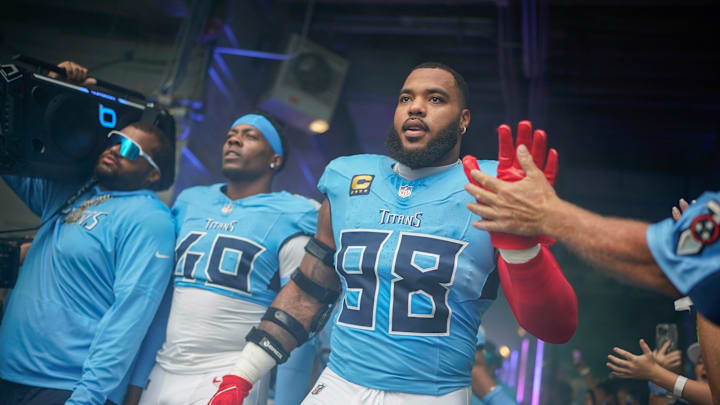 Tennessee Titans defensive tackle Jeffery Simmons (98) and linebacker Arden Key (49) prepare to take the field before the game against the Los Angeles Rams at Nissan Stadium in Nashville, Tenn., Sunday, Sept. 14, 2025.