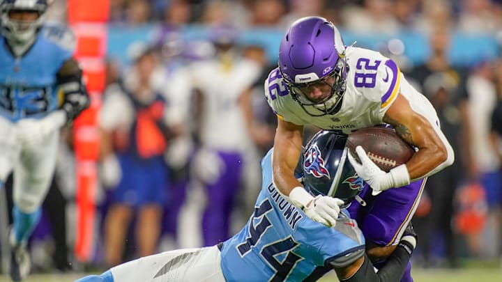 Tennessee Titans safety Mike Brown (44) stops Minnesota Vikings wide receiver Jeshaun Jones (82)
