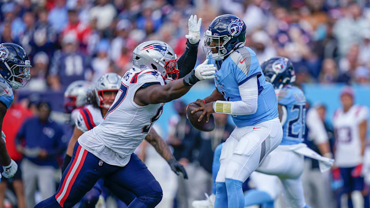 New England Patriots defensive end Milton Williams (97) sacks Tennessee Titans quarterback Cam Ward (1) during the third quarter at Nissan Stadium in Nashville, Tenn., Sunday, Oct. 19, 2025.