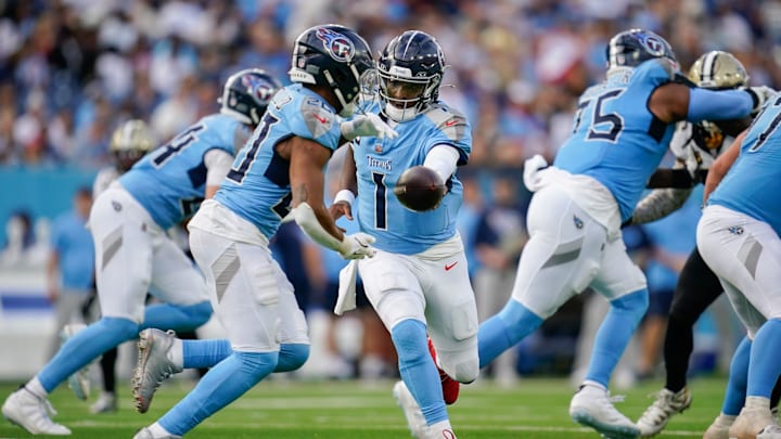Tennessee Titans quarterback Cam Ward (1) hands off to running back Tony Pollard (20) during the fourth quarter against the New Orleans Saints at Nissan Stadium in Nashville, Tenn., Sunday, Dec. 28, 2025.