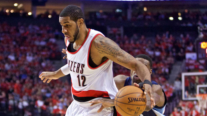 Apr 27, 2015; Portland, OR, USA; Portland Trail Blazers forward LaMarcus Aldridge (12) loses the ball as Memphis Grizzlies forward Tony Allen (9) reaches for the steal during the second quarter in game four of the first round of the NBA Playoffs at the Moda Center. Mandatory Credit: Craig Mitchelldyer-Imagn Images