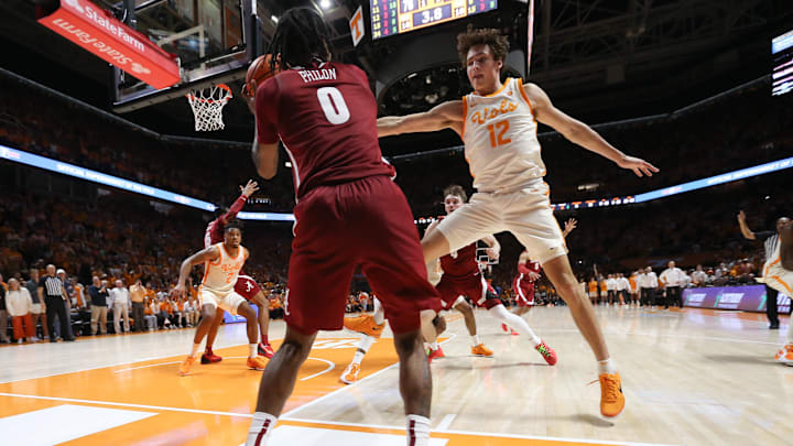 Mar 1, 2025; Knoxville, Tennessee, USA; Alabama Crimson Tide guard Labaron Philon (0) tries to get the ball in play against Tennessee Volunteers forward Cade Phillips (12) with 3.8 seconds left in the game at Thompson-Boling Arena at Food City Center. Mar 1, 2025; Knoxville, Tennessee, USA; Alabama Crimson Tide guard Labaron Philon (0) tries to get the ball in play against Tennessee Volunteers forward Cade Phillips (12) with 3.8 seconds left in the game at Thompson-Boling Arena at Food City Center.