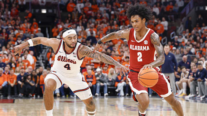 Nov 19, 2025; Chicago, Illinois, USA; Alabama Crimson Tide guard Aden Holloway (2) drives to the basket against Illinois Fighting Illini guard Kylan Boswell (4) during the second half at United Center. Mandatory Credit: Kamil Krzaczynski-Imagn Images Nov 19, 2025; Chicago, Illinois, USA; Alabama Crimson Tide guard Aden Holloway (2) drives to the basket against Illinois Fighting Illini guard Kylan Boswell (4) during the second half at United Center. Mandatory Credit: Kamil Krzaczynski-Imagn Images