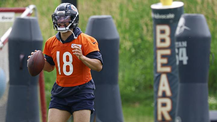 Caleb Williams looks upfield during minicamp passing drills. Caleb Williams looks upfield during minicamp passing drills.