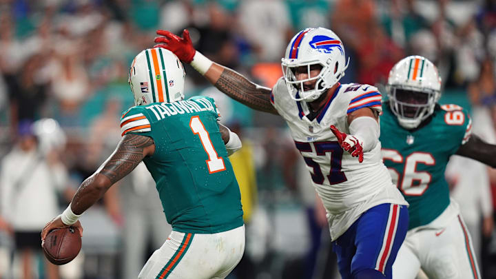Sep 12, 2024; Miami Gardens, Florida, USA; Buffalo Bills defensive end AJ Epenesa (57) pressures Miami Dolphins quarterback Tua Tagovailoa (1) during the second half at Hard Rock Stadium. Sep 12, 2024; Miami Gardens, Florida, USA; Buffalo Bills defensive end AJ Epenesa (57) pressures Miami Dolphins quarterback Tua Tagovailoa (1) during the second half at Hard Rock Stadium.