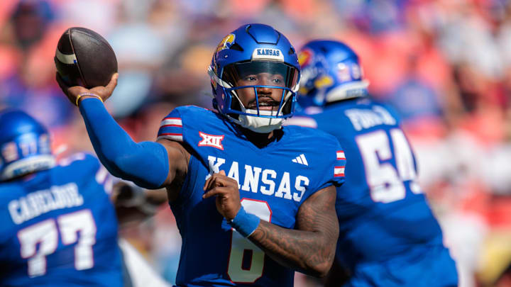 Oct 19, 2024; Kansas City, Missouri, USA; Kansas Jayhawks quarterback Jalon Daniels (6) passes the ball against the Houston Cougars during the first quarter at GEHA Field at Arrowhead Stadium. Mandatory Credit: William Purnell-Imagn Images Oct 19, 2024; Kansas City, Missouri, USA; Kansas Jayhawks quarterback Jalon Daniels (6) passes the ball against the Houston Cougars during the first quarter at GEHA Field at Arrowhead Stadium. Mandatory Credit: William Purnell-Imagn Images