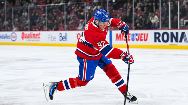 Dec 3, 2024; Montreal, Quebec, CAN; Montreal Canadiens right wing Patrik Laine (92) shoots the puck against the New York Islanders during the first period at Bell Centre. Mandatory Credit: David Kirouac-Imagn Images
