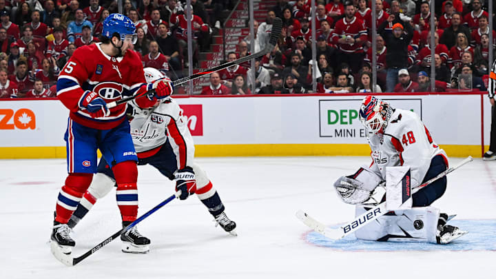 Apr 27, 2025; Montreal, Quebec, CAN; Washington Capitals goalie Logan Thompson (48) makes a save against Montreal Canadiens center Alex Newhook (15) during the third period in game four of the first round of the 2025 Stanley Cup Playoffs at Bell Centre. Mandatory Credit: David Kirouac-Imagn Images