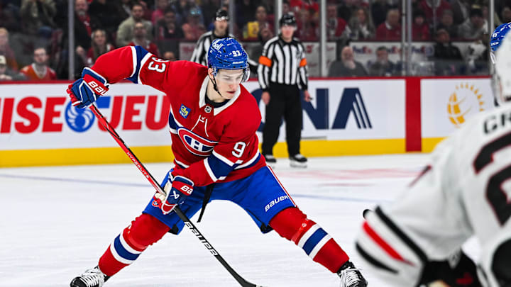 Apr 14, 2025; Montreal, Quebec, CAN; Montreal Canadiens right wing Ivan Demidov (93) plays the puck against the Chicago Blackhawks in the second period at Bell Centre. Mandatory Credit: David Kirouac-Imagn Images