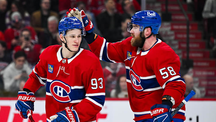 Apr 14, 2025; Montreal, Quebec, CAN; Montreal Canadiens defenseman David Savard (58) congratulates right wing Ivan Demidov (93) after his first career NHL goal against the Chicago Blackhawks in the first period at Bell Centre. Mandatory Credit: David Kirouac-Imagn Images