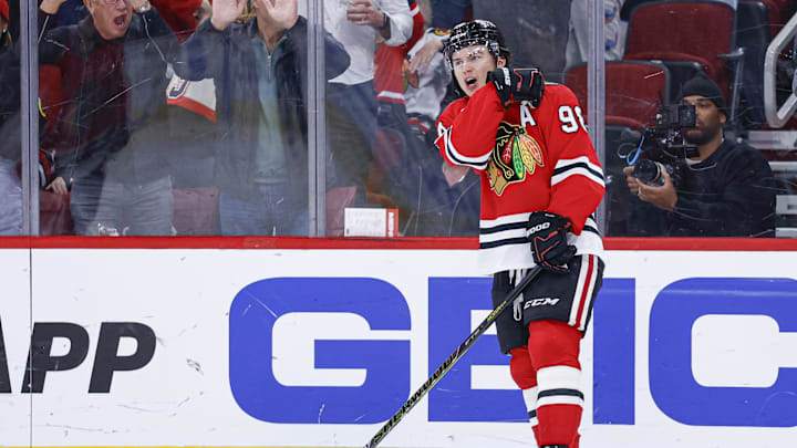 Nov 18, 2025; Chicago, Illinois, USA; Chicago Blackhawks center Connor Bedard (98) reacts after scoring against the Calgary Flames during the second period at United Center. Mandatory Credit: Kamil Krzaczynski-Imagn Images