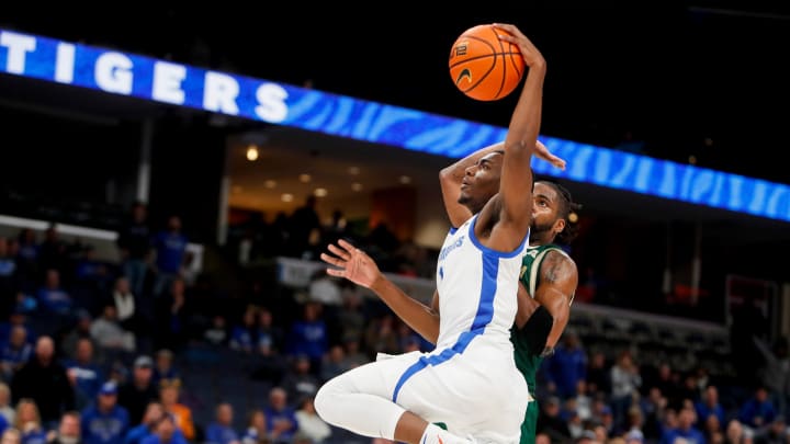 Memphis' Jayhlon Young (1) goes to dunk the ball during the game between the University of South Florida and the University of Memphis at FedExForum in Memphis, Tenn., on Thursday, January 18, 2024. USF defeated Memphis 74-73. Memphis' Jayhlon Young (1) goes to dunk the ball during the game between the University of South Florida and the University of Memphis at FedExForum in Memphis, Tenn., on Thursday, January 18, 2024. USF defeated Memphis 74-73.