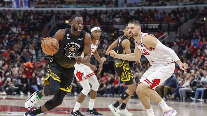 Jan 15, 2023; Chicago, Illinois, USA; Golden State Warriors forward Draymond Green (23) drives to the basket against Chicago Bulls center Nikola Vucevic (9) during the first half of an NBA game at United Center. Mandatory Credit: Kamil Krzaczynski-Imagn Images Jan 15, 2023; Chicago, Illinois, USA; Golden State Warriors forward Draymond Green (23) drives to the basket against Chicago Bulls center Nikola Vucevic (9) during the first half of an NBA game at United Center. Mandatory Credit: Kamil Krzaczynski-Imagn Images