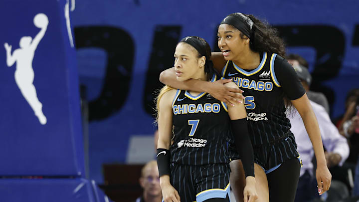 Aug 25, 2024; Chicago, Illinois, USA; Chicago Sky guard Chennedy Carter (7) reacts next to forward Angel Reese (5) after scoring against the Las Vegas Aces during the second half at Wintrust Arena. Mandatory Credit: Kamil Krzaczynski-Imagn Images