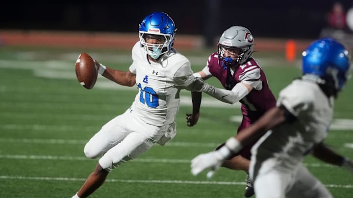 Antioch's Andre Adams (10) runs with the ball as he pushed out of bounds by Collierville's Tristin Plumee (21) during the second round Class 6A playoff game