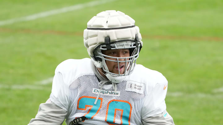 Miami Dolphins offensive tackle Kendall Lamm (70) wears a Guardian helmet cap during practice at the PSD Bank Arena. 