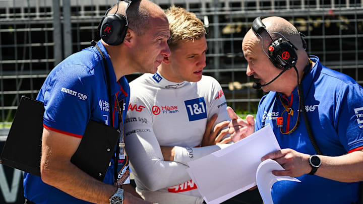 Jun 19, 2022; Montreal, Quebec, CAN; Haas Team driver Mick Schumacher of Germany discusses with his engineer on the starting grid before the Montreal Grand Prix at Circuit Gilles Villeneuve. Mandatory Credit: David Kirouac-Imagn Images