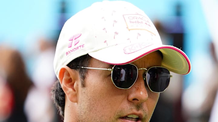 May 5, 2024; Miami Gardens, Florida, USA; Red Bull Racing driver Sergio Perez (11) arrives in the paddock before the Miami Grand Prix at Miami International Autodrome. Mandatory Credit: John David Mercer-Imagn Images