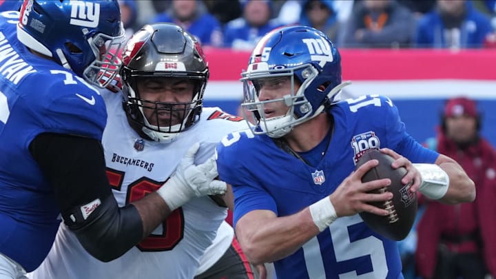 East Rutherford, NJ -- November 24, 2024 -- Vita Vea of Tampa Bay chases Tommy DeVito of the Giants in the first half as the Tampa Bay Buccaneers came to MetLife Stadium to play the New York Giants.