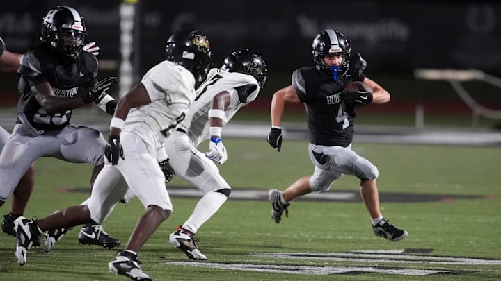 Houston’s Brennen Odle (4) runs with the ball during the game between Whitehaven High School and Houston High School in Germantown, Tenn., on August 29, 2025.