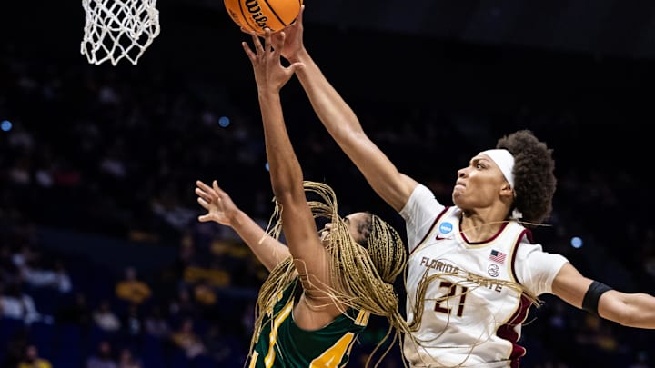 Mar 22, 2025; Baton Rouge, Louisiana, USA;  Florida State Seminoles forward Makayla Timpson (21) blocks the shot of George Mason Patriots forward Nalani Kaysia (42) during the second half at Pete Maravich Assembly Center. Mandatory Credit: Stephen Lew-Imagn Images